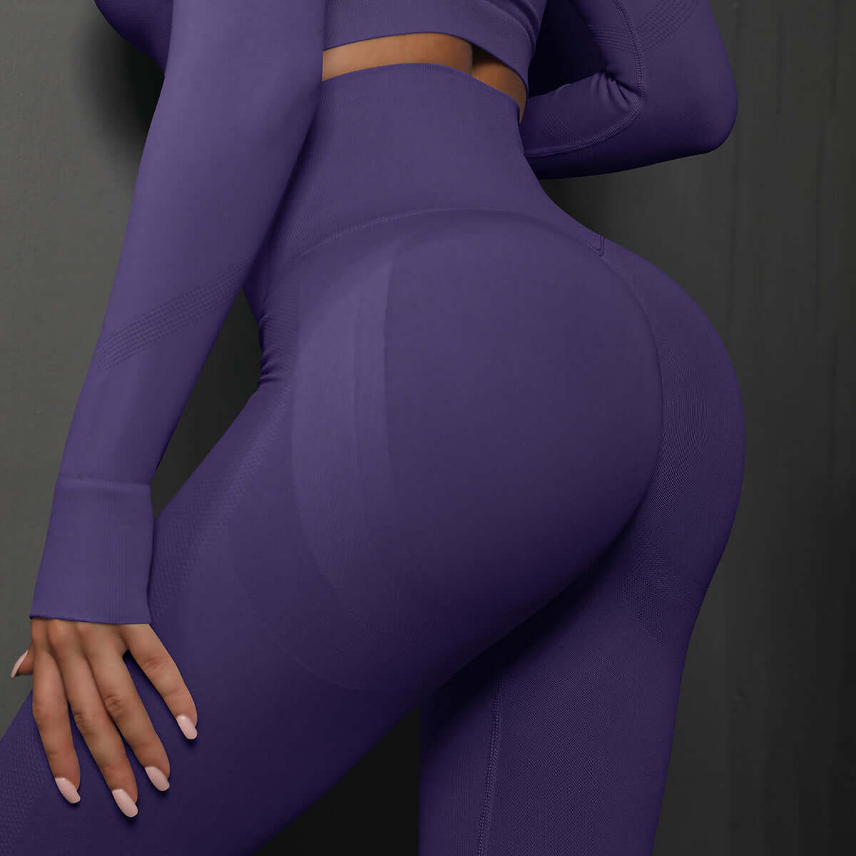 Woman wearing high waist purple leggings showcasing back and fit, highlighting comfort and style.