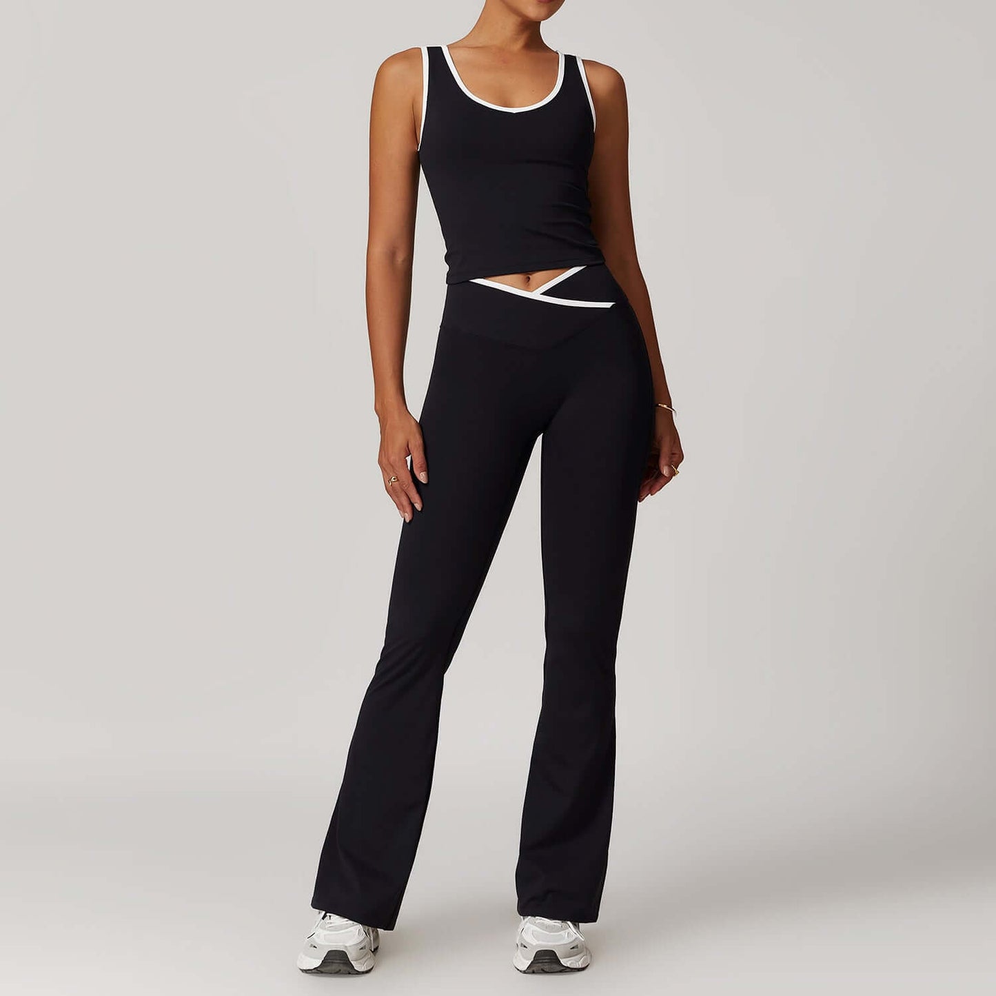 Women's seamless yoga outfit in black, featuring stretchy fabric and comfortable fit, ideal for gym and activewear styles.