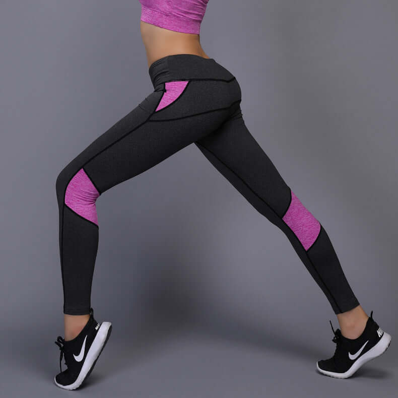 Woman wearing athletic mesh panel leggings in pink and gray; polyester fiber; available in sizes S to XL; side view showcasing stretchy fit.