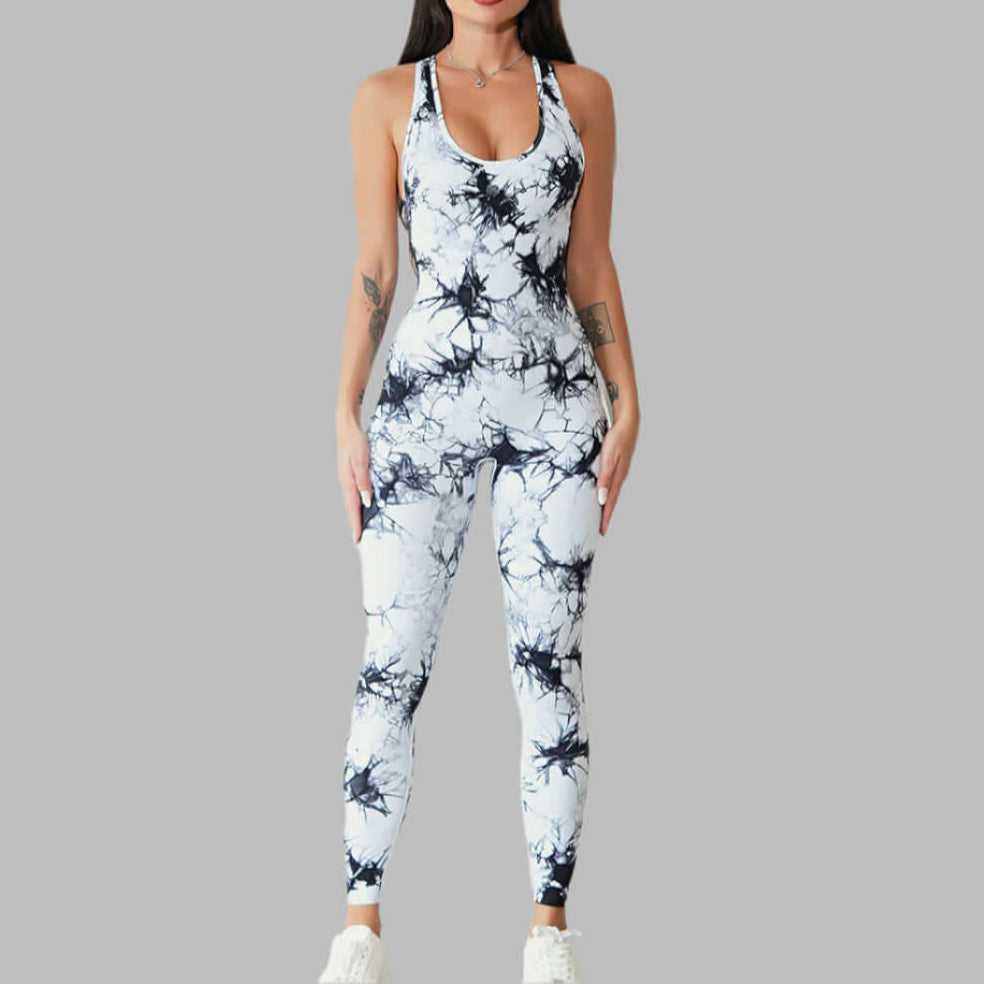 Woman wearing a stylish compression workout bodysuit with abstract pattern, perfect for yoga and fitness, against a gray background.