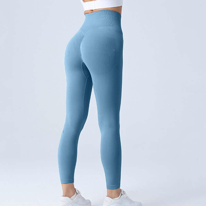 High-waisted blue workout running leggings for women, available in sizes S, M, L, designed for comfort and flexibility during exercise.