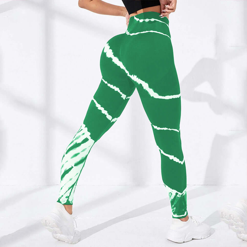 Green and white tie-dye compression workout pants for fitness and style, high-waisted and ankle-length with comfortable fit.