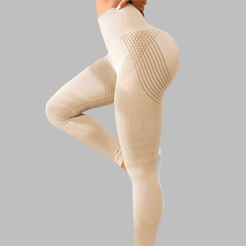 High waist beige sport leggings for women with hip lifting design and stretch material on a gray background.
