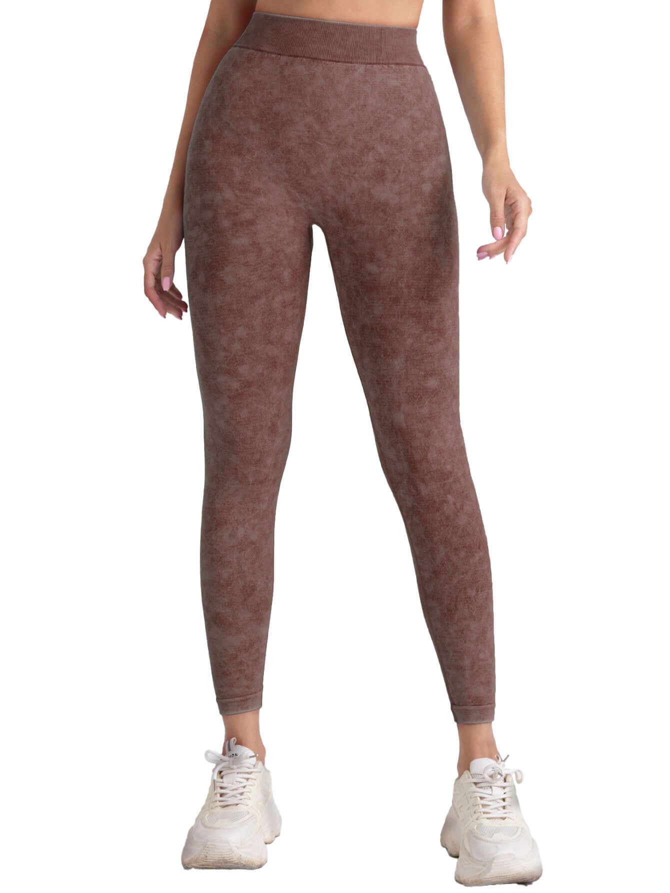Woman wearing brown high-waist gym leggings, showcasing fitness style.
