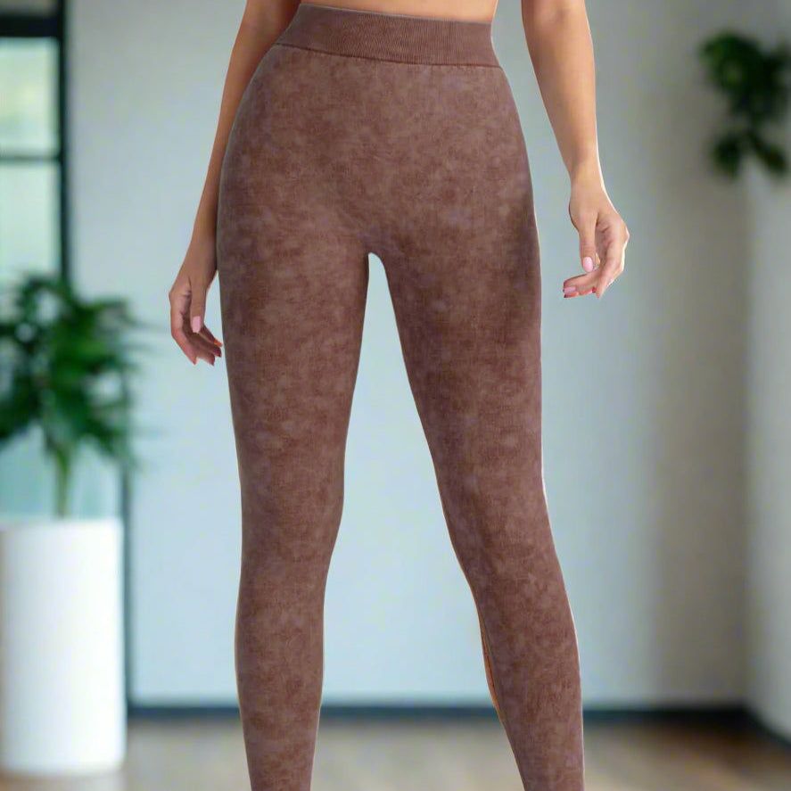Woman wearing brown high-waist gym leggings, showcasing fitness style.