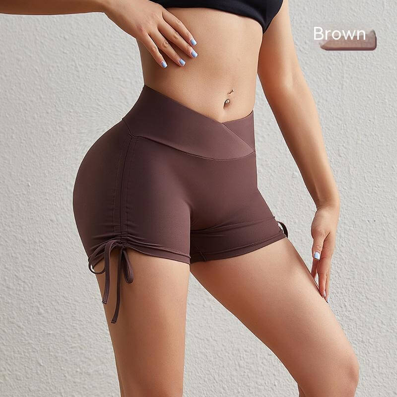 Women's brown yoga drawstring shorts, high-waisted, perfect for fitness and comfortable stretch. Side view highlighting details.
