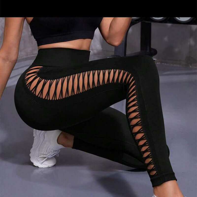 Woman wearing black crisscross butt-lift gym leggings, designed for workout and enhancing curves.