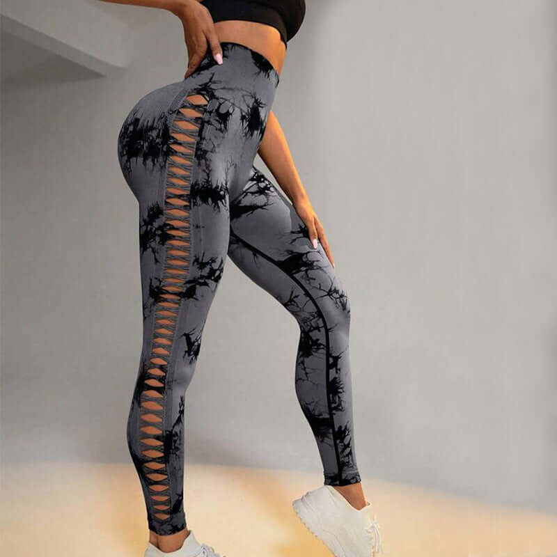 Side view of woman wearing gray butt-lift gym leggings with lace-up design, perfect for enhancing curves during workouts.