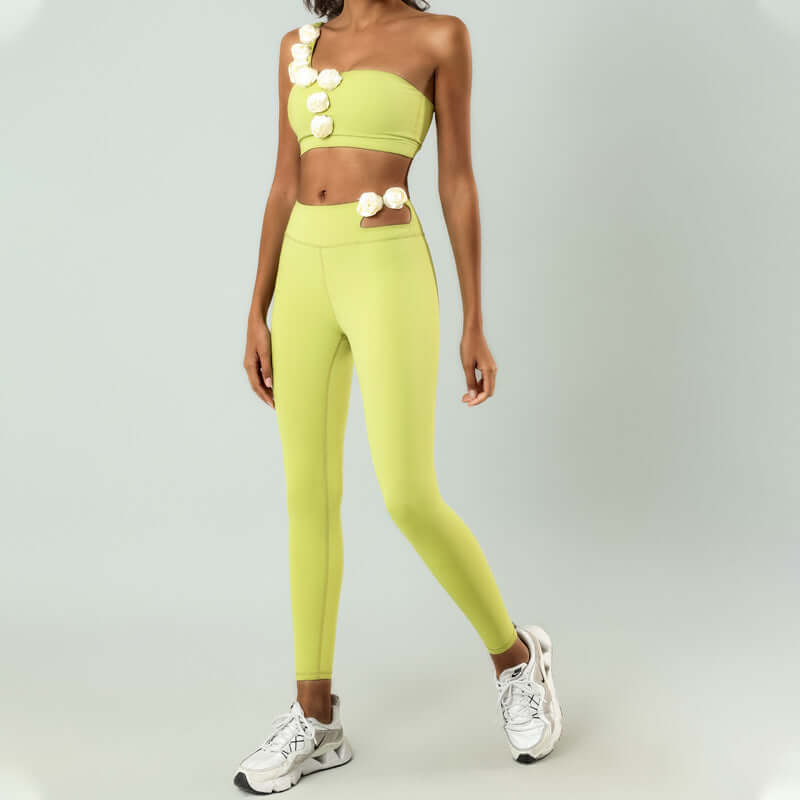 Woman wearing lime green high elastic activewear set with floral embellishments, perfect for yoga or fitness.
