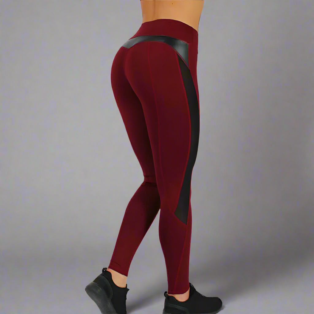 Red Wine High-Waist Gym Leggings for dynamic workouts, offering firm support and confident shaping on a scenic beach.
