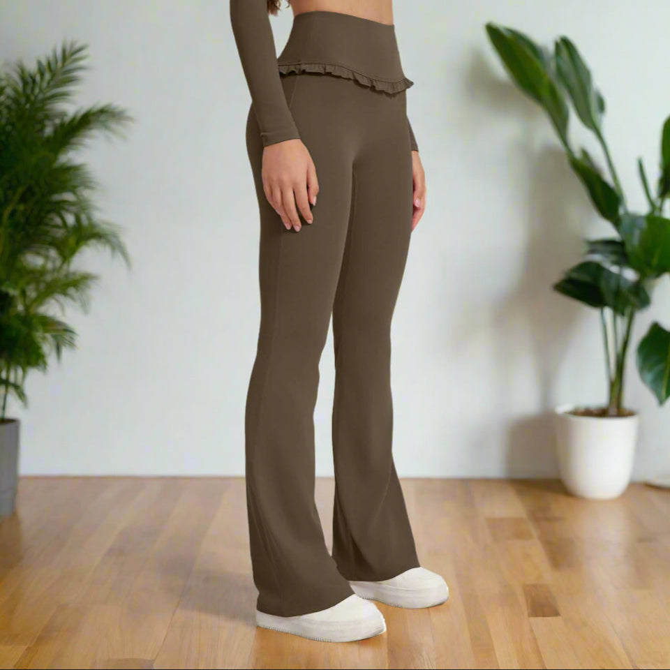 Woman wearing olive high waist leggings with flared legs and ruffle detail