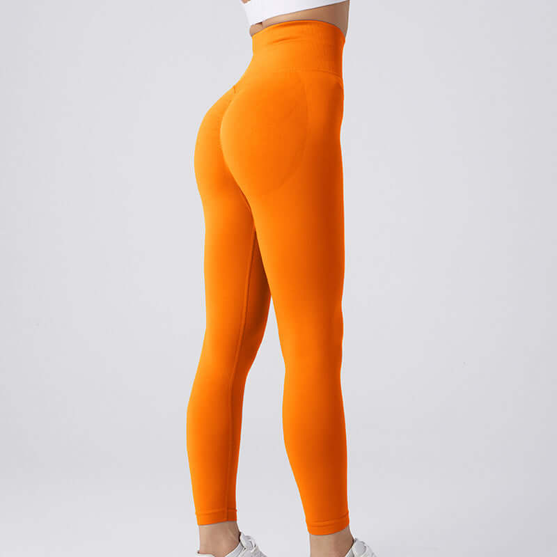 Bright orange workout running leggings, fitted design, high-waisted, available in sizes S, M, L. Comfortable and stylish activewear.