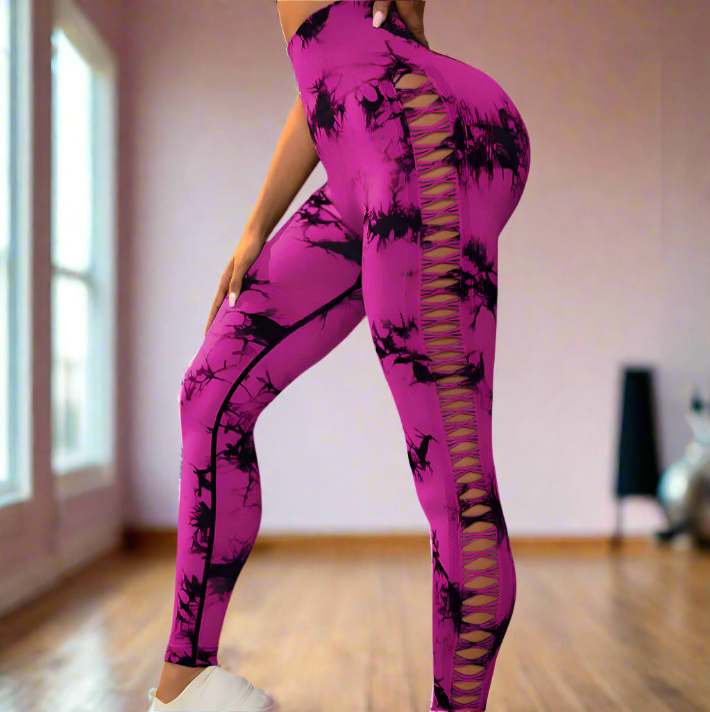Fashionable purple butt-lift gym leggings with lace-up side design, floral print, and flattering fit for workouts and casual wear.