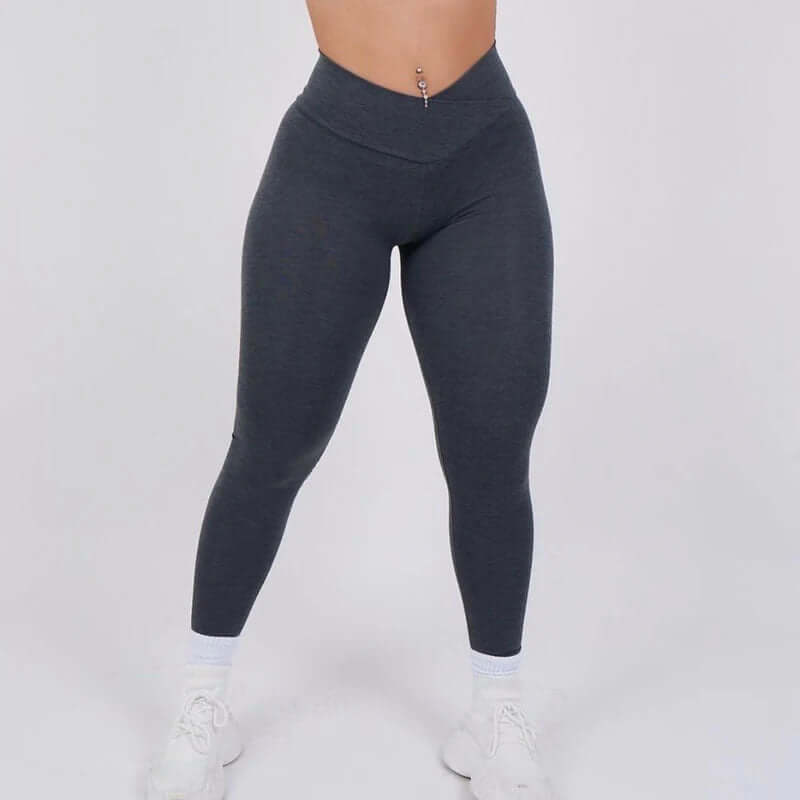 Sculpt Fit Scrunch Leggings in dark grey, high-waisted design, perfect for workout or casual wear, modeled on a white background.