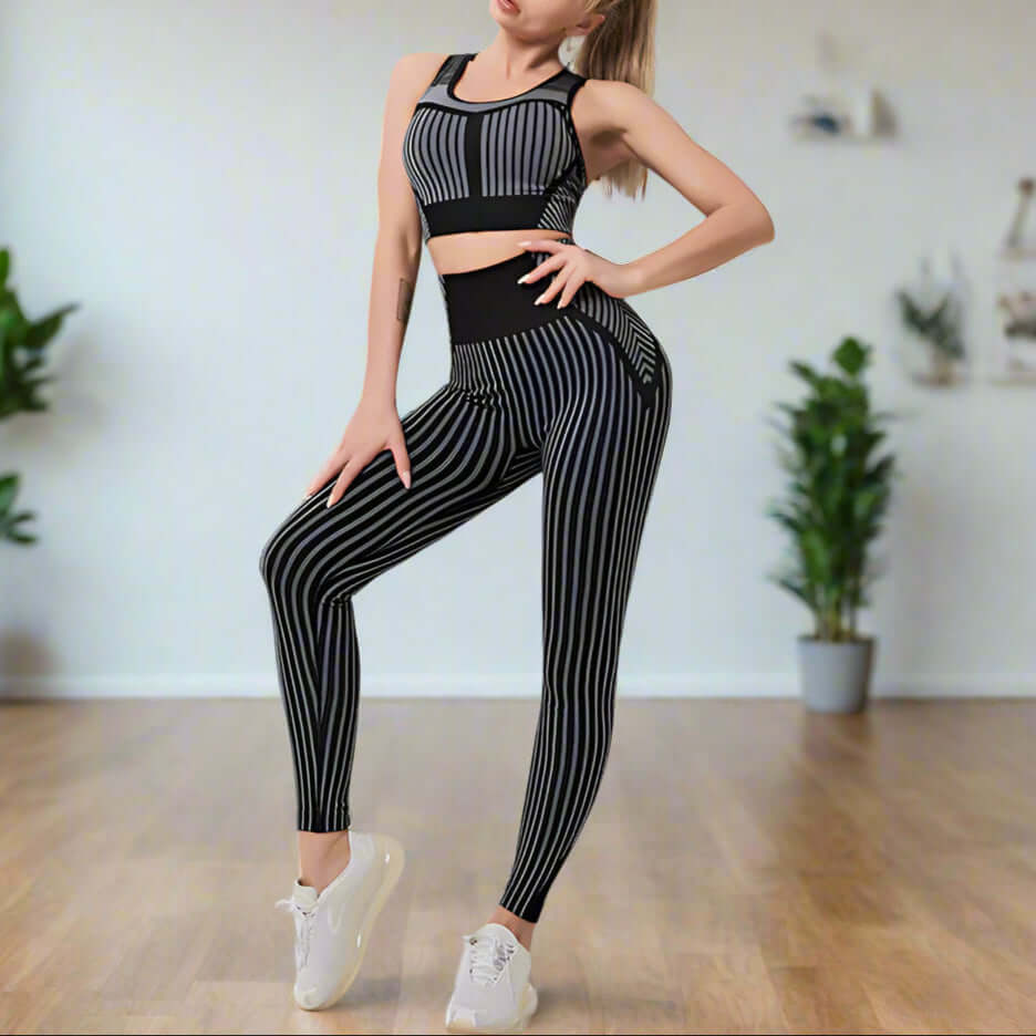 Woman in stripe-pattern seamless fitness set made of milk silk fabric, showcasing moisture-wicking and stylish support for yoga or workouts.