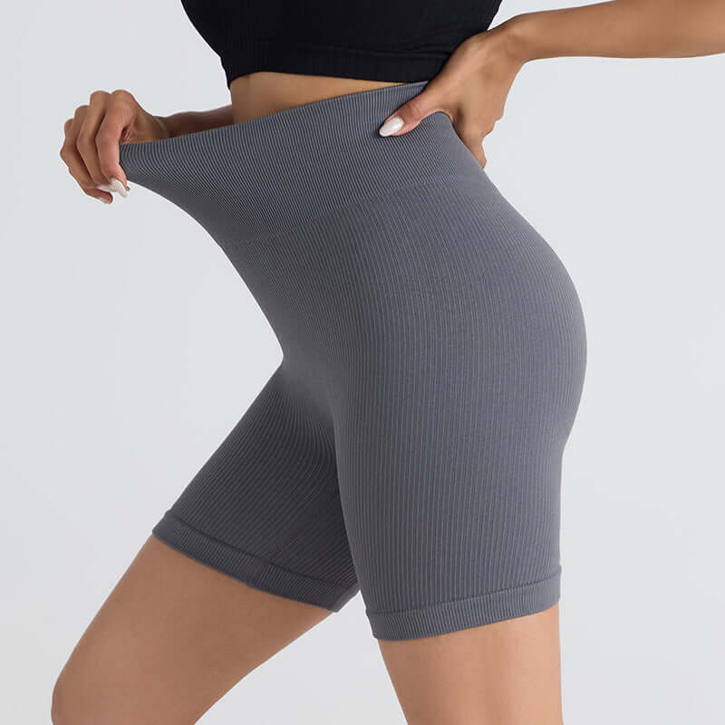 Close-up of gray seamless stretch shorts showcasing flexibility with a flattering fit, perfect for yoga and fitness.
