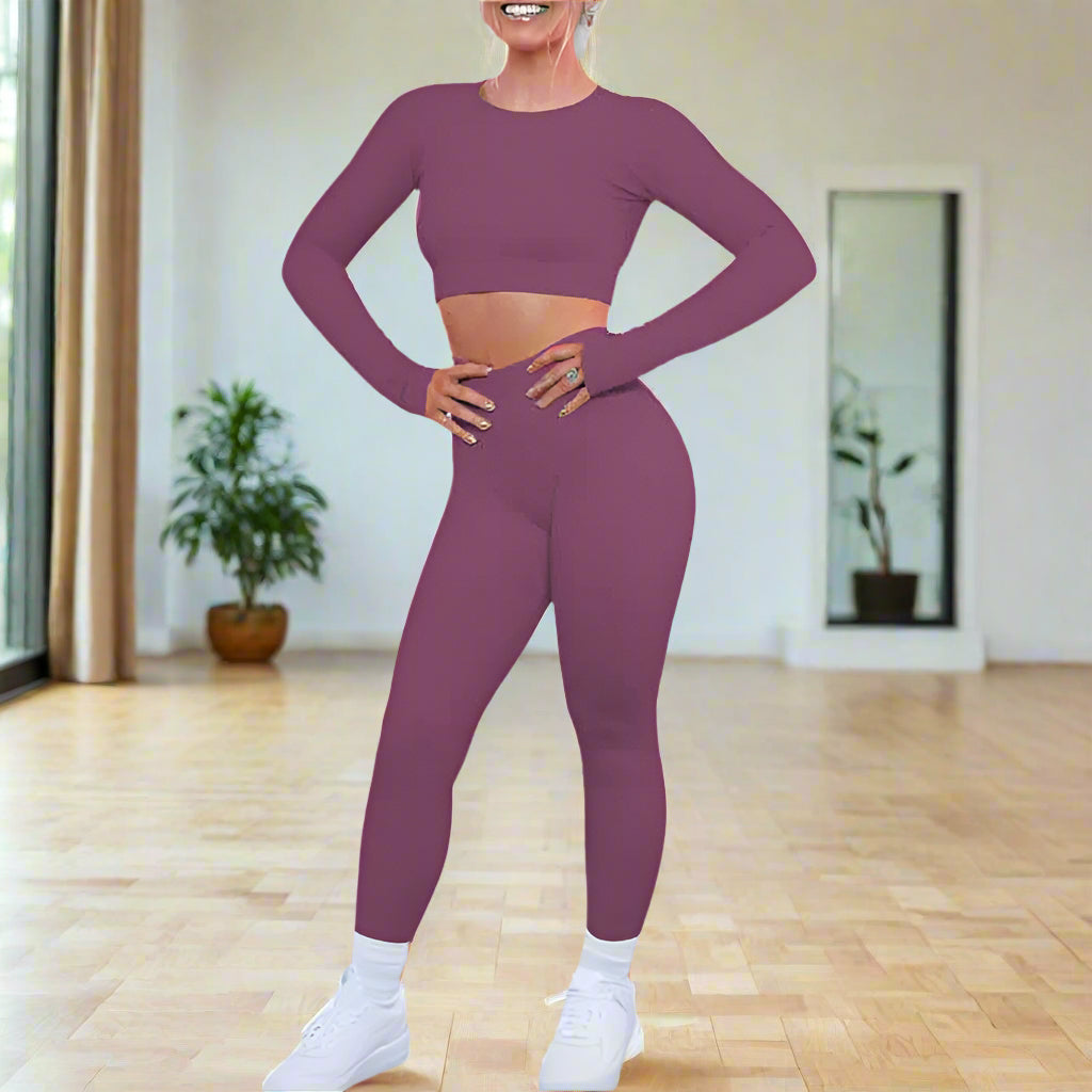 Woman wearing seamless knitted striped suit in purple, standing confidently outdoors.