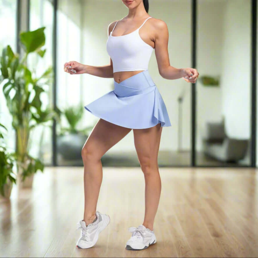 Woman wearing sport yoga shorts with built-in skirt design, perfect for moisture absorbency in all seasons.