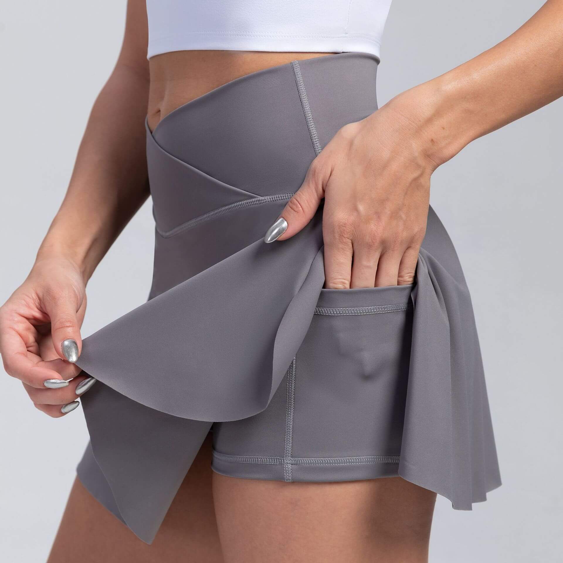 Women's sport yoga shorts with built-in skirt in solid color, showcasing moisture-wicking fabric and stylish design for all seasons.