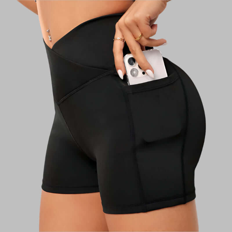 Black workout compression shorts with phone pocket, high-waisted, comfortable fit for gym and fitness activities.