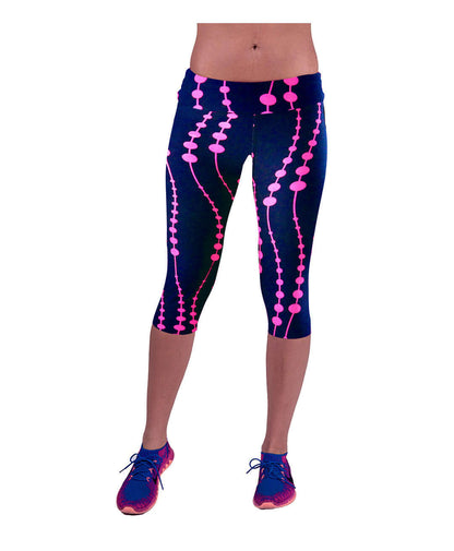 Women's printed yoga leggings with vibrant pink design on navy background, ideal for fitness and casual wear.