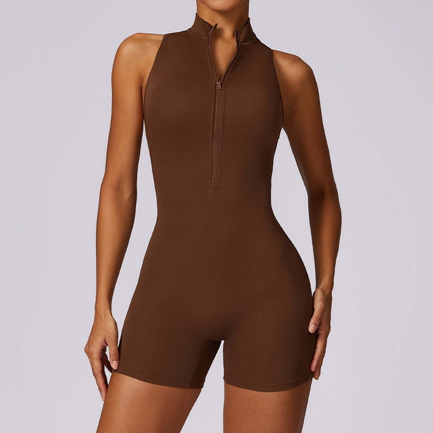 Supportive back yoga jumpsuit in brown. Made from organic cotton. Relaxed fit with breathable material.