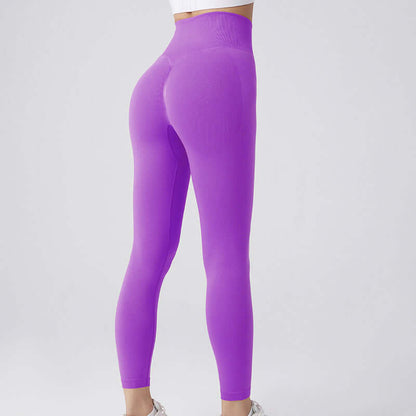 Purple workout running leggings showcasing a snug fit, available in sizes S, M, L. Ideal for exercising with style and comfort.