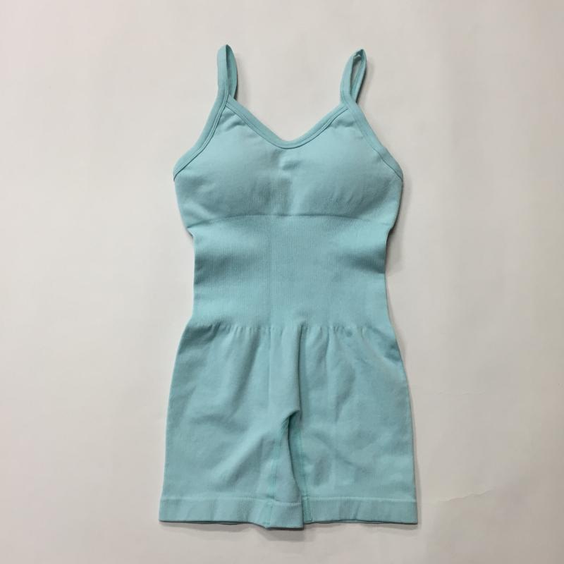 Alt Tag: Light blue seamless knit yoga jumpsuit in organic cotton. Relaxed fit with breathable material. Ideal for comfort and style.