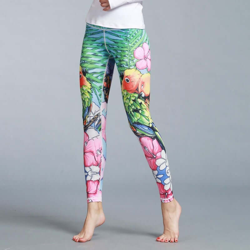 Colorful printed yoga leggings with vibrant parrot and floral design, perfect for fitness and fashion.