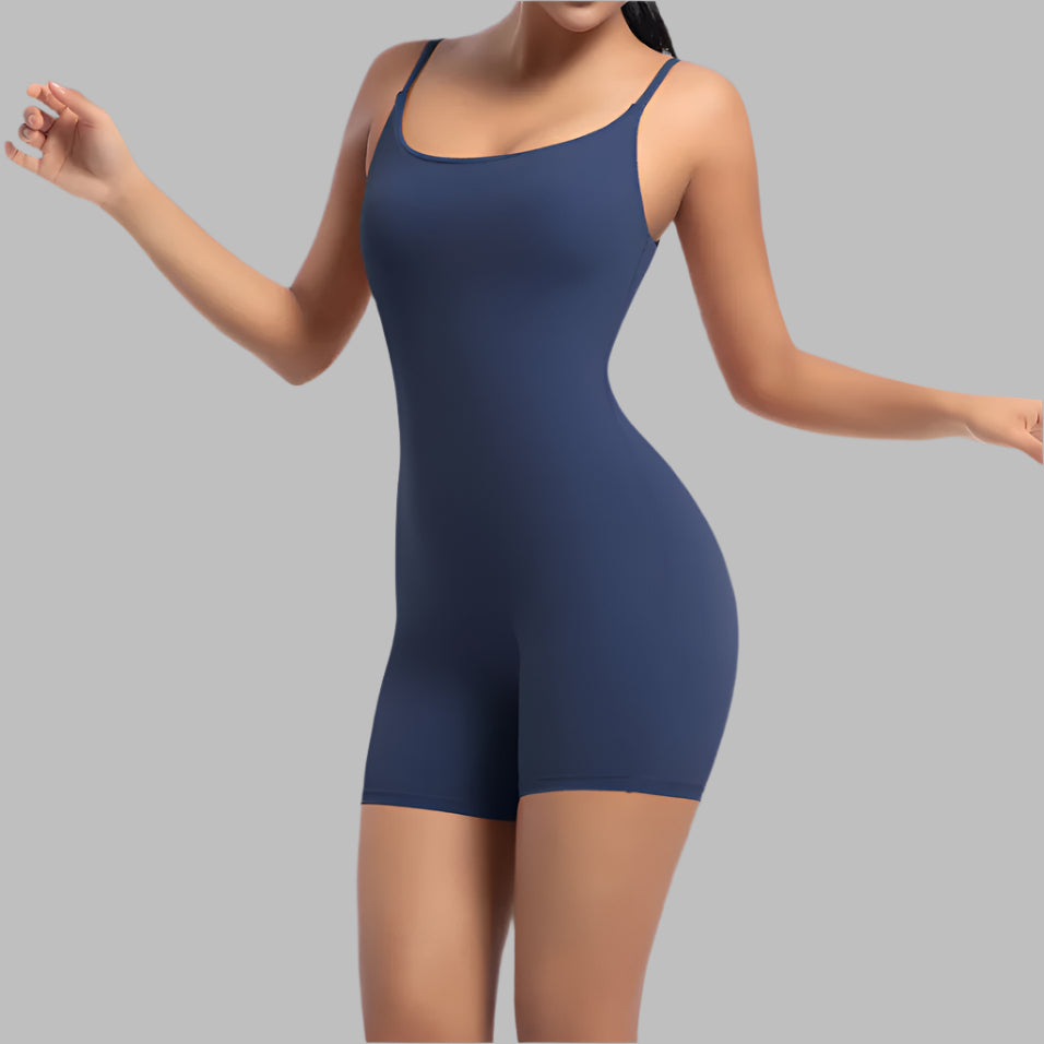 Sporty yoga bodysuit in navy. Made from organic cotton. Features a relaxed fit and breathable material.