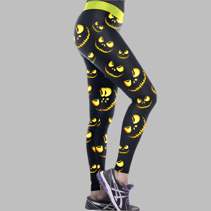 Black leggings with yellow Halloween pumpkin faces design, shown in a side profile, available in sizes S, M, L, XL for sporty fashion.