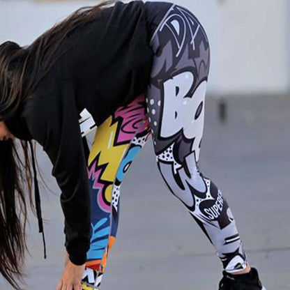 Vibrant printed sports leggings with bold graphics worn by a woman bending over, showcasing flexibility and street style flair.