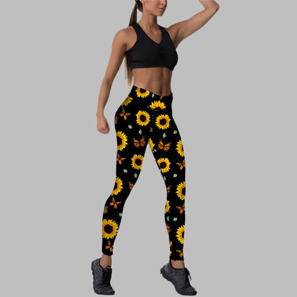 Woman in workout attire with sunflower print leggings, showcasing floral design for active wear fashion.