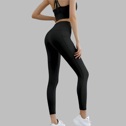 Black high waist pocket leggings shown from the side, paired with athletic top and white sneakers, highlighting fit and style.