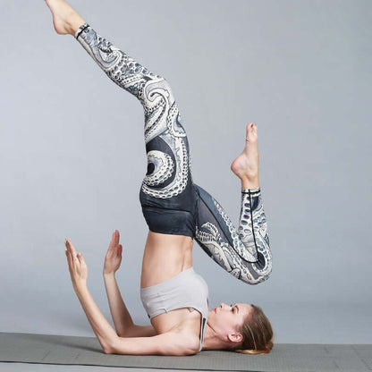 Woman performing yoga in printed leggings with intricate design