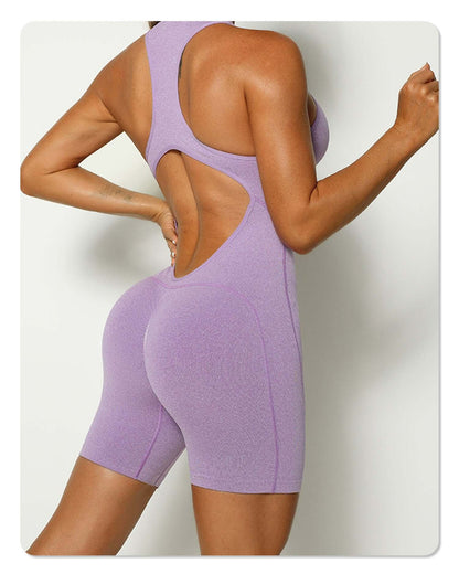 Back view of a purple zip-up sleeveless romper in organic cotton. Features a relaxed fit and breathable material. Perfect for comfort.