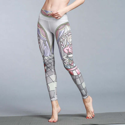 Women wearing printed yoga leggings with artistic design, showcasing flexibility on a gray background.