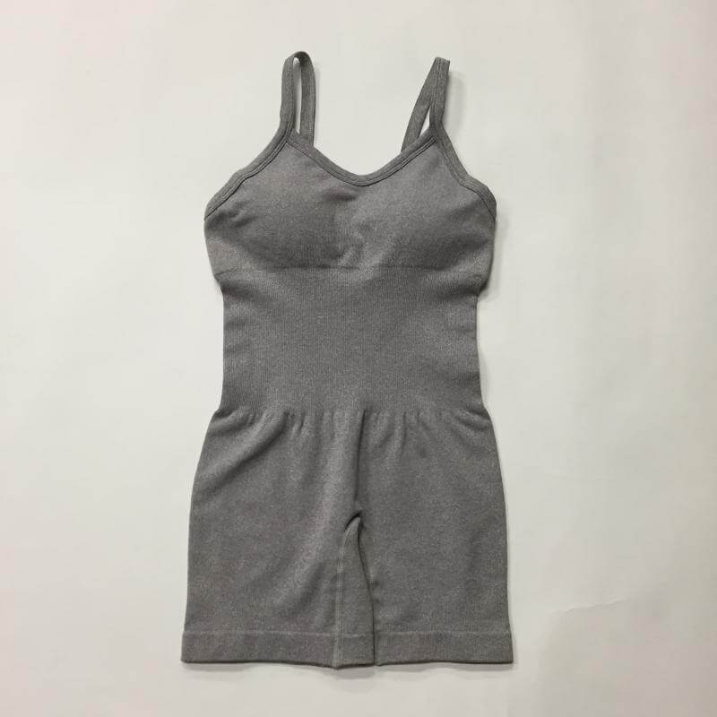 Seamless Knit Yoga Jumpsuit in gray. Made from organic cotton. Features a relaxed fit and breathable material for comfort.