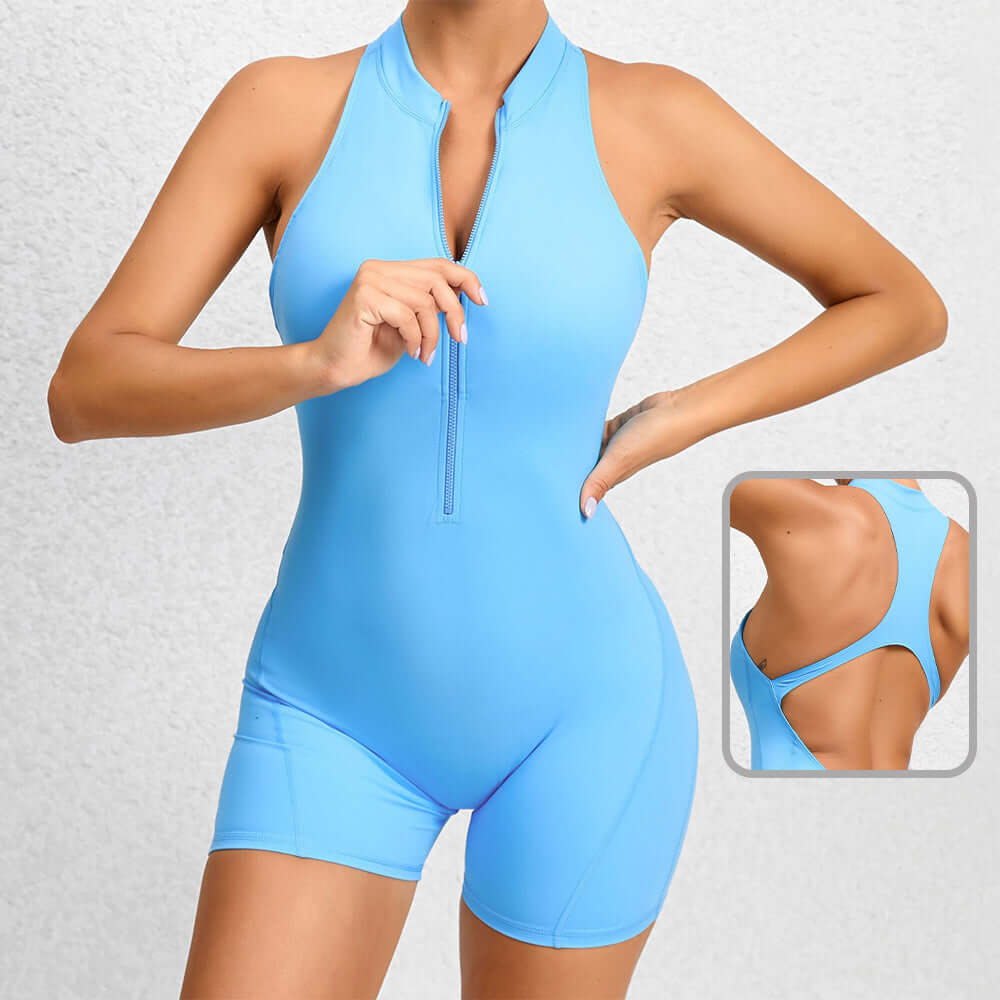 Women's blue fitness romper with zipper, made from organic cotton. Relaxed fit, breathable material. Ideal for workouts.