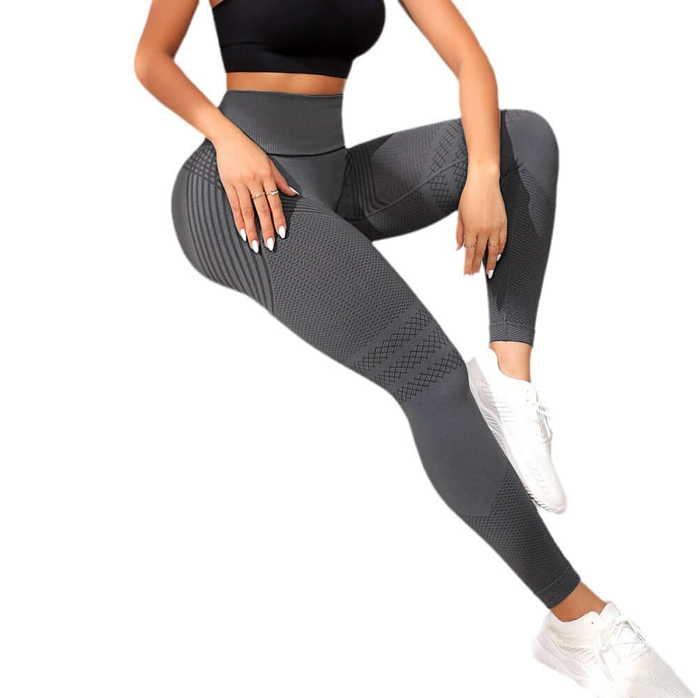 Women's high waist stretch leggings in dark gray, showcasing hip lifting design and sporty fit, perfect for workouts.