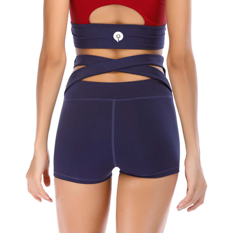 Back view of seamless yoga shorts in navy blue with crisscross waistband, showing size options S-XL for waist 56-68cm and hip 70-82cm.