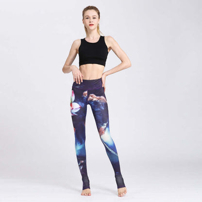 Model wearing printed yoga pants and black sports top, showcasing gym fashion.