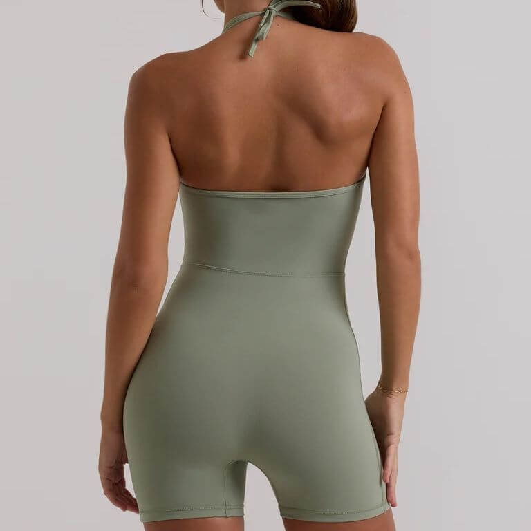 Back view of green body sculpting jumpsuit highlighting fit and design, perfect for stylish and flattering wear.