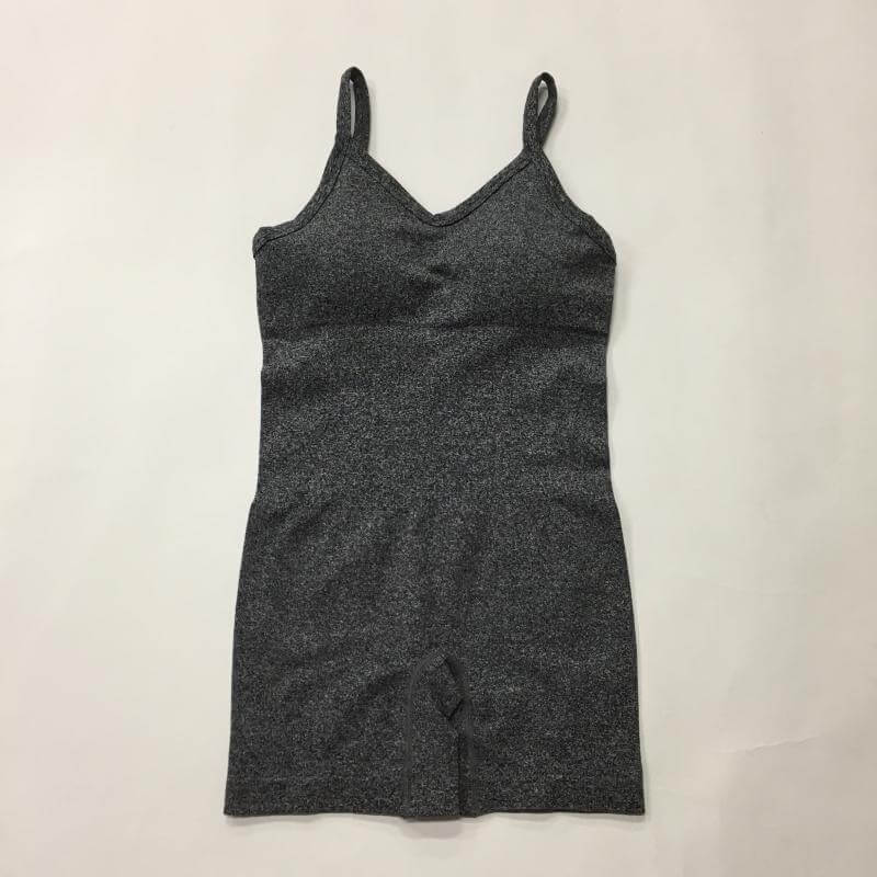 Seamless knit yoga jumpsuit made from organic cotton. Features relaxed fit and breathable material for comfort. Perfect for workouts.