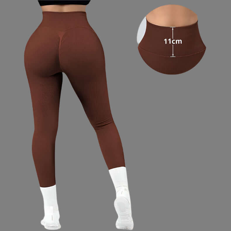 Back view of seamless brown fitness leggings with high waistband detail, suitable for gym workouts, shown on a model.