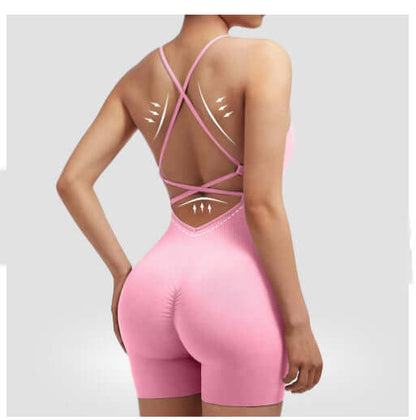 Back view of pink seamless quick-dry romper made from organic cotton. Features breathable material and a relaxed fit for workouts.