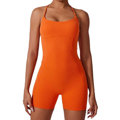 Sporty yoga bodysuit in orange. Made from organic cotton. Features a relaxed fit and breathable material for comfort.