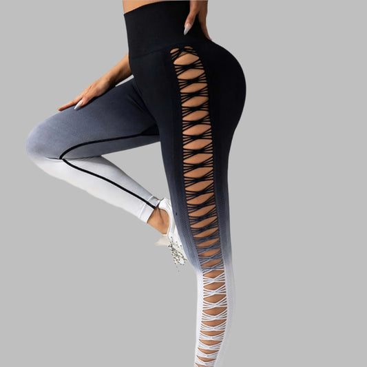 Woman wearing gradient booty leggings with lattice cutouts, showcasing stylish athletic wear.