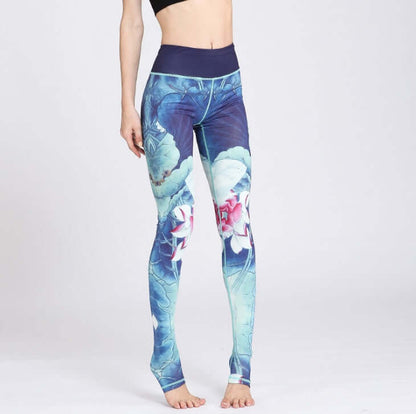 Woman wearing printed yoga pants with floral blue design, showcasing a comfortable fit for active wear; available in sizes S to XL.