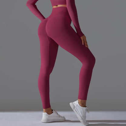 Seamless high waist leggings in dragon fruit color, shown from the back with a focus on fit and comfort, ideal for active wear.